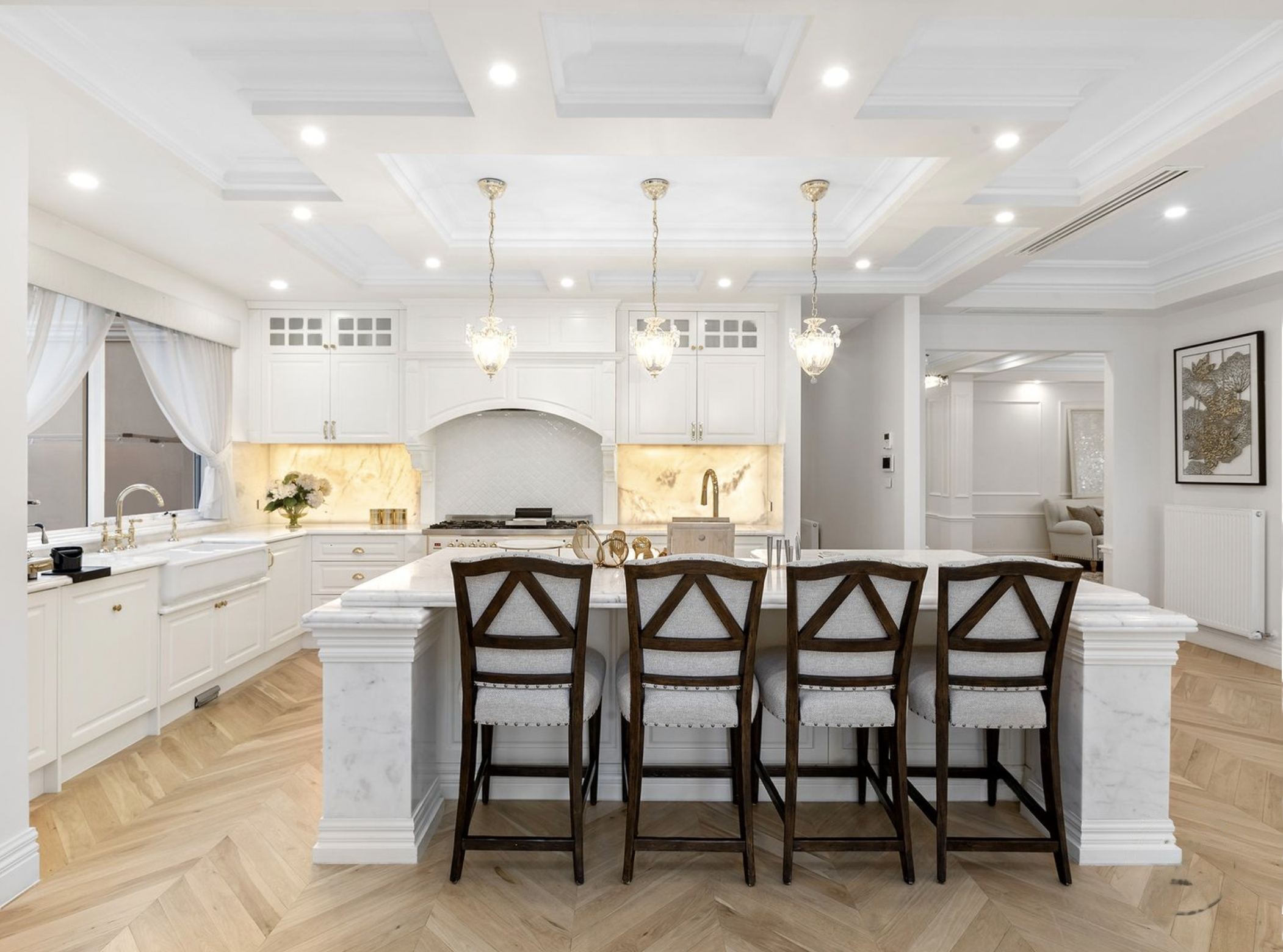 A hamptons style kitchen with natural stone kitchen benchtops.