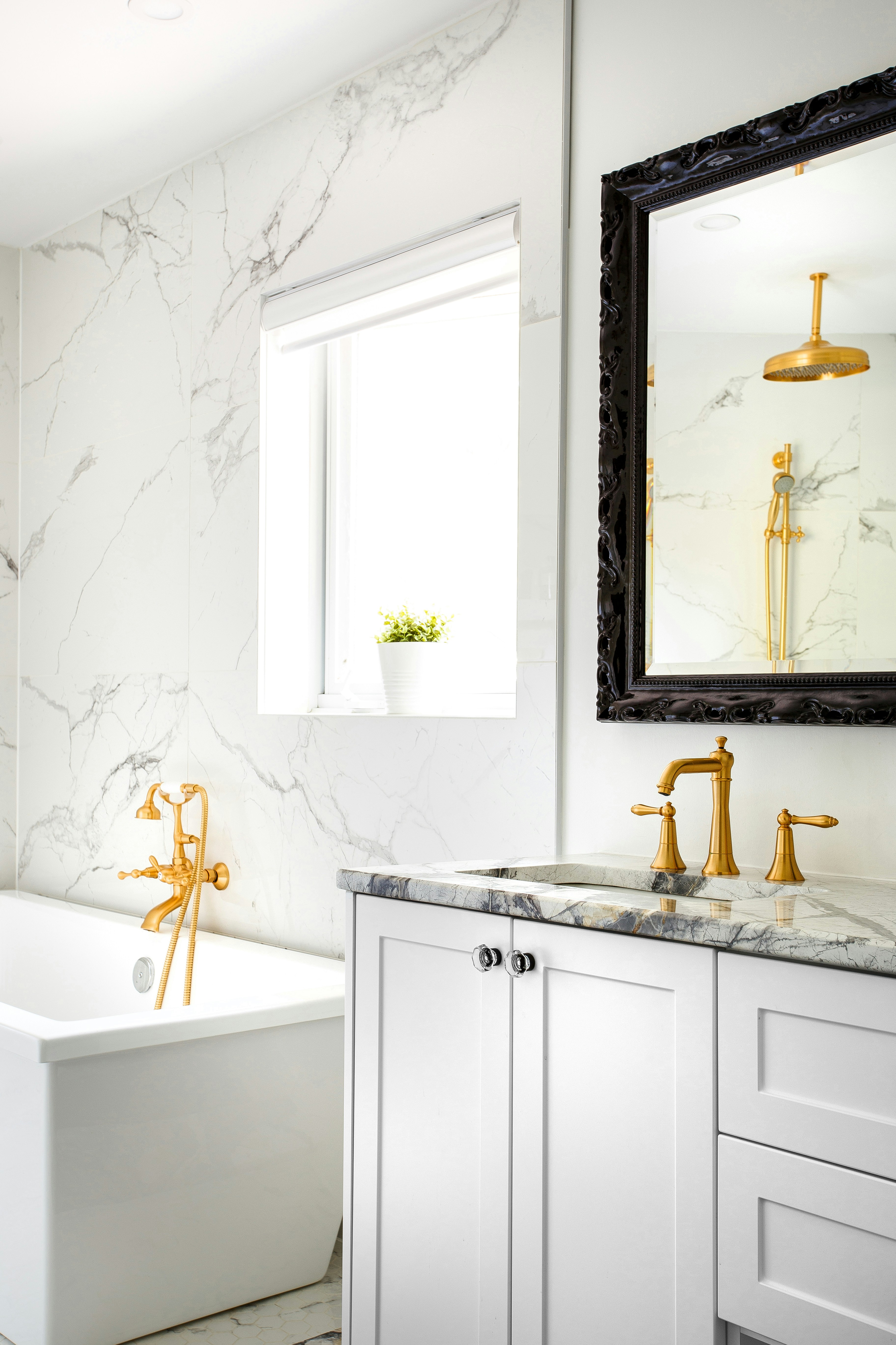 Quartzite stone vanity in a Melbourne bathroom with marbled walls